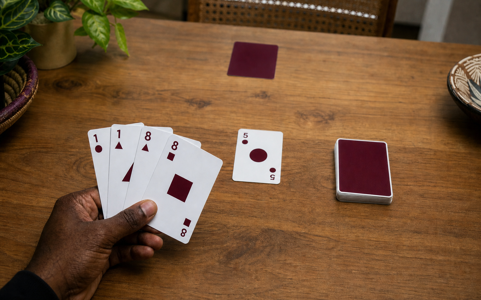 A Whot endgame with Circle 5 on the table and four cards held for a one-versus-one challenge.