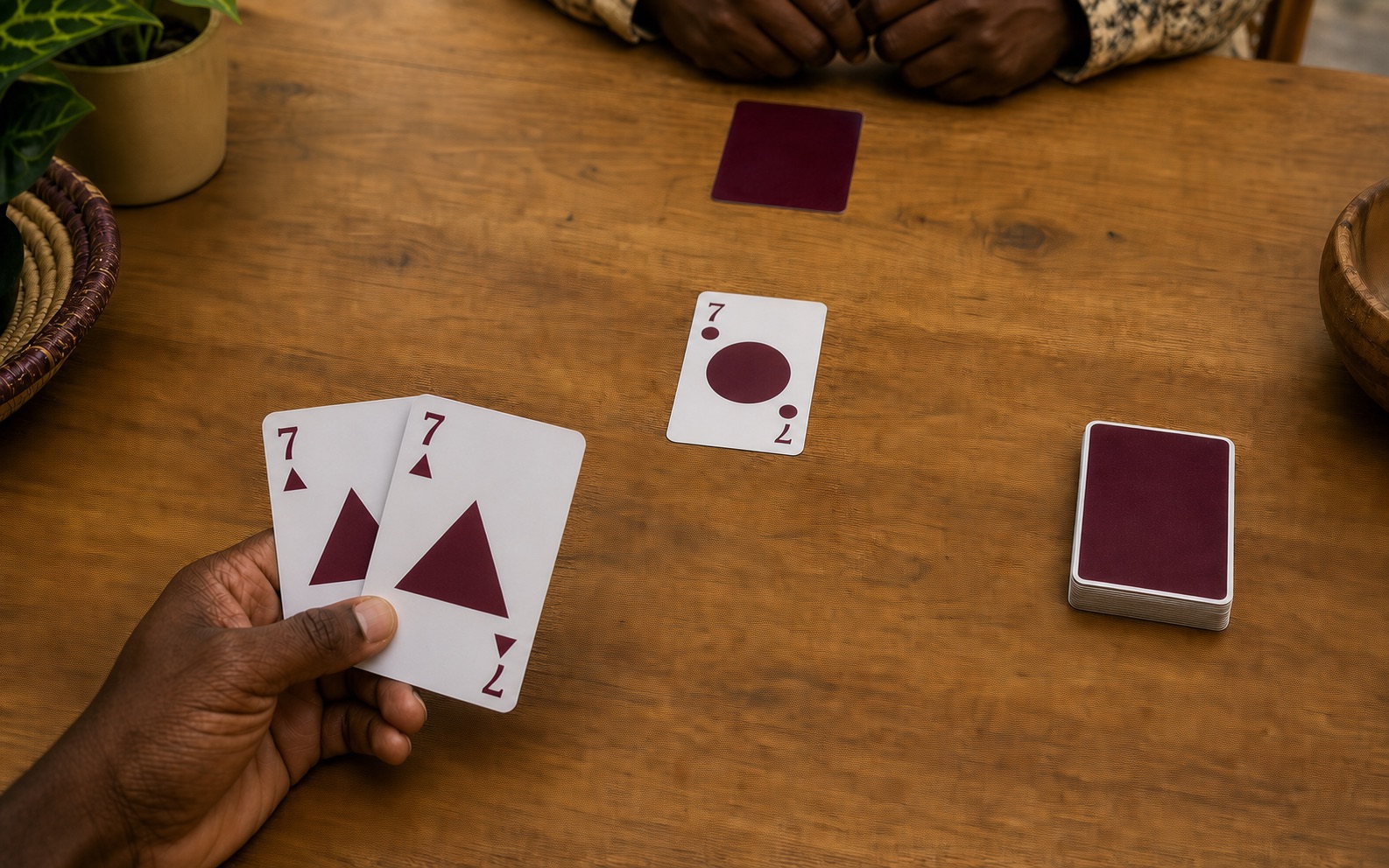 A Whot player using two cards with the same number to switch from one shape to another.